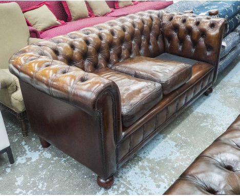 CHESTERFIELD SOFA, vintage, deep buttoned, tan brown leather upholstered, with three cushions and turned supports, 182cm W.