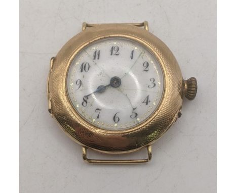 An early 20th century 14ct yellow gold cased ladies manual wind wrist watch A/F having engine turned decoration, total weight
