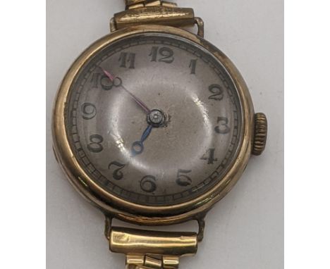 A 9ct yellow gold cased ladies manual wind wristwatch A/F on a gold plated expanding bracelet, total weight 24.3g Location:If