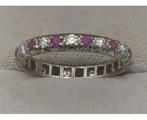 A diamond and ruby white metal eternity ring A/F, white metal testing as 18ct gold, size V, 3.9gLocation:If there is no condi