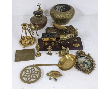 Assorted brassware to include pots, an incense burner, a candlestick with a swinging anchor underneath, a Welsh mining figure