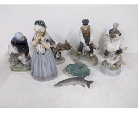 Ten Royal Copenhagen figures to include a woman feeding a cow, a frog on a lilypad, a fish, a woman with a goose and other fi