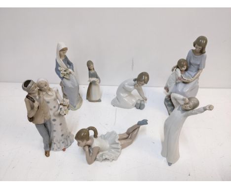 Four Lladro, two Nao and another figure to include a woman holding flowers A/F, children reading and others Location: 5.4If t