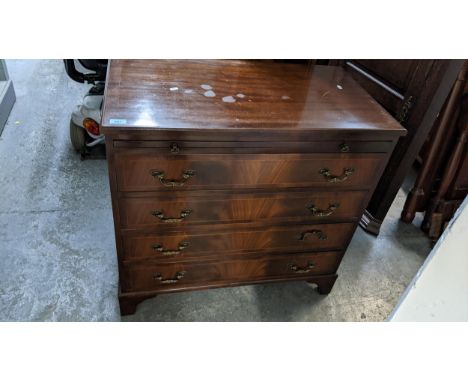 A reproduction mahogany gentleman's dressing chest, inlaid stringing to top and drawer fronts, brushing slide above four draw