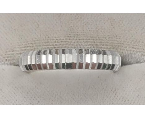 An 18ct white gold textured wedding band, 2.8g, size 'R 1/2'Location:If there is no condition report, please request.