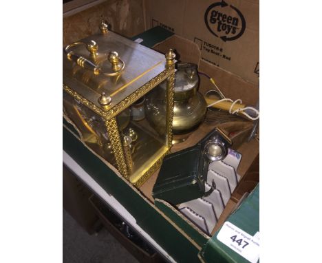 A box of misc. including a quartz clock, a Poole toast rack, a sewing accoutrement set modelled as a travel case, an Eastern 
