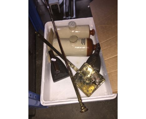 A mixed lot including stoneware water bottles, a copper hunting horn, two irons, chestnut roaster etc. 