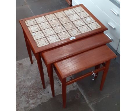 A retro mid 20th century tile top teak nest of tables.