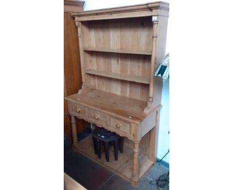 A pine dresser.Good solid condition, some general wear to include light surface marks and scratches. There has been holes for