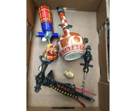 A collection of novelty corkscrews, and a Satsuma style long stemmed flagon with hallmarked silver stopper, bone netsuke 