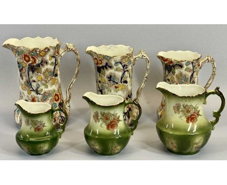 VINTAGE DECORATIVE JUGS - two sets of three in graduated sizes, the green trio stamped 'Rockingham pottery, Staffordshire, En