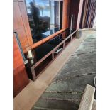 Havelock International bespoke made media console in macassar with glass top on chrome block glide