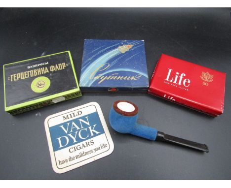 Vintage cigarettes, pipe and beer mat