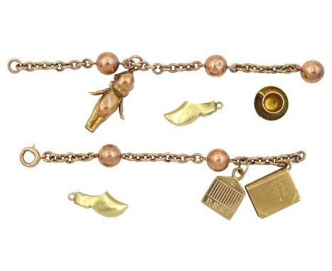 Rose gold link bracelet, four 9ct gold charms including teacup and saucer, Love story book and a pair of 14ct gold clogsCondi