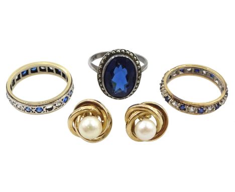 Two gold stone set full eternity rings, pair of gold pearl stud earrings, all 9ct and a silver blue paste stone and marcasite