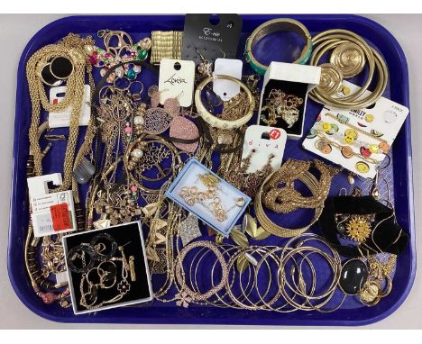 An Assortment of Gilt Coloured Jewellery, to include stacking bangles, statement clip-on earrings, diamanté floral bracelet, 