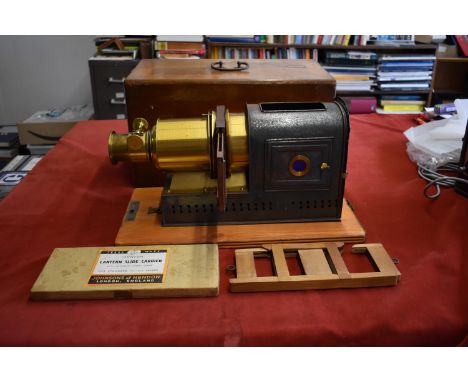 Helioscopic Magic lantern, circa 1880-1910. It has been adapted to take a light bulb and works. Steel  blued body with brass 