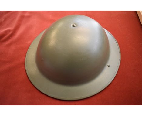 British WWII steel 'Brodie' helmet complete with liner and chin strap, the in liner is made in brown leather, no stamps on th