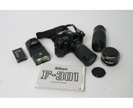  A Nikon F301 35mm camera with a Vivitar and a Sigma zoom lens, Cobra flashgun, assorted filters and documents.
