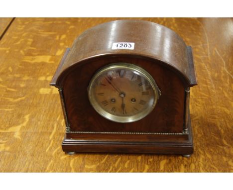A mahogany mantel clock the arch shaped case with brass pilasters 