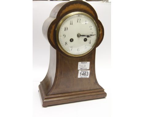 An Edwardian inlaid mahogany mantel clock with an enamel dial and French movement striking on a gong