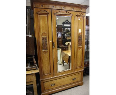 An Edwardian satin walnut wardrobe