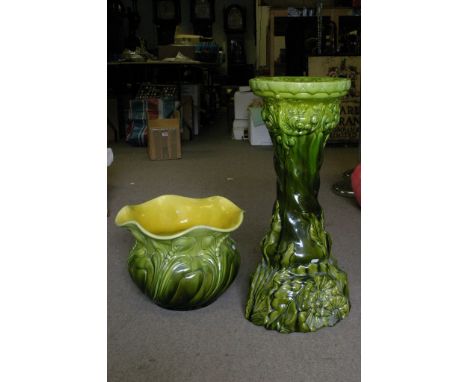 A green and yellow glazed Bretby jardiniere on pedestal stand of Art Nouveau design