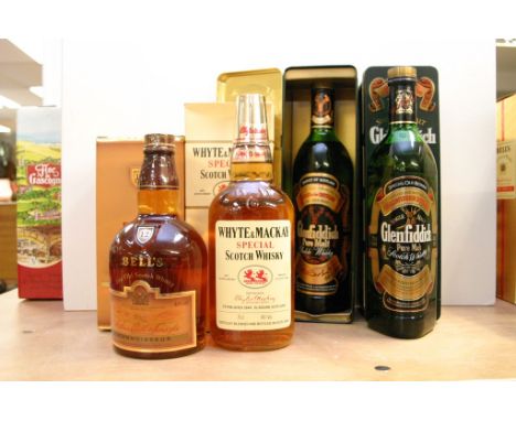 Two 75cl bottles of Glenfiddich Pure Malt Scotch Whisky each in a presentation tin, possibly 80s bottling, together with a bo