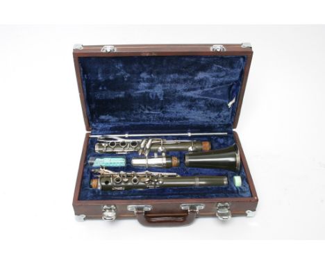 A vintage, cased, Lark clarinet, with spare reeds