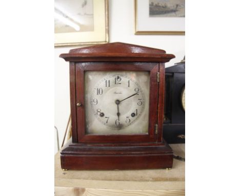 An Ansonia mantle clock with pendulum and key