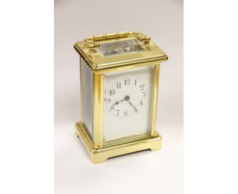 A Brass Case Carriage Clock the enamel dial with Arabic numerals
