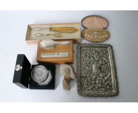 A box containing a collection of oddments including a cased dress stud set, silver and mother of pearl fork, cased white meta