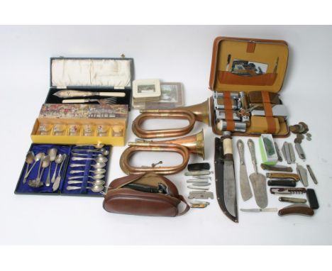 A box containing a bugle, penknives, plated odds and other items