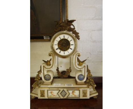 An attractive 19th century French marble mantle clock having applied gilt metal and cherub decoration, with key