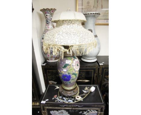  A ceramic table lamp decorated with flowers and foliage 