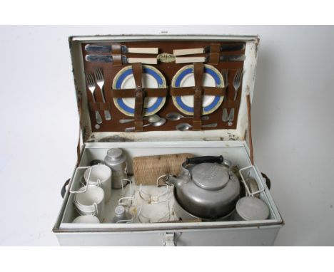 A metal Garrison picnic hamper and contents