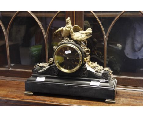 A Victorian black slate mantel clock with applied gilt metal mounts fitted with a French movement 