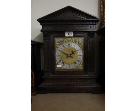 An Oak Mantel Clock the classical case inset with brass dial 