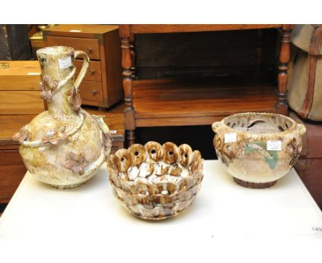 A jardiniere on pedestal with large art pottery jug and two planters