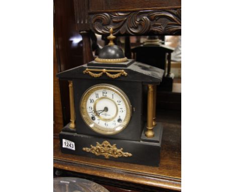 A late Victorian metal cased mantel clock a damaged minors lamp and a vintage fire extinguisher 
