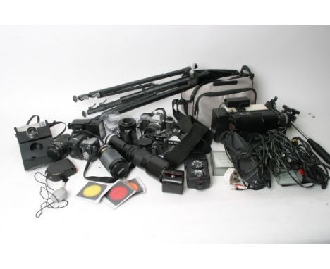 A video camera and a collection of cameras and accessories