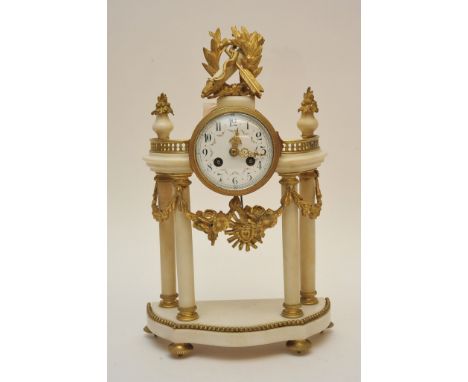 A quality 19th century French white marble and gilt metal mantle clock with enamel dial gilt metal swags and pillar supports