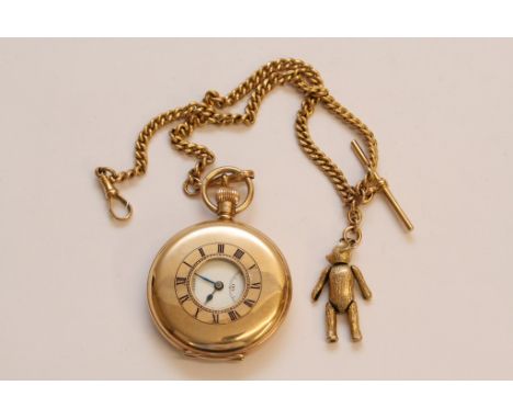 A 9ct gold full size button wind half hunter pocket watch with attached 9ct gold Albert chain and articulated Teddy bear