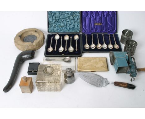 A mixed box of cutlery, cigarette cases, an inkwell and other miscellaneous items