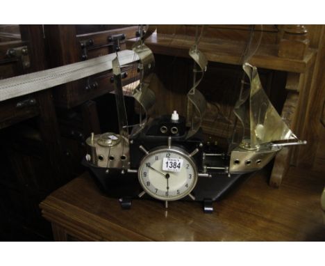 A Metamic combined clock and table lamp formed as a sailing ship