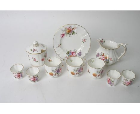 A collection of Royal Crown Derby porcelain in the Derby Posies pattern including a jug, a sugar pot with lid, cups, dish and