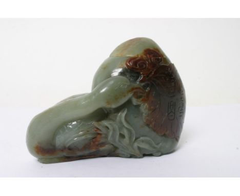 A Chinese carved hardstone jar and cover of russet and green colour in the form of a stylised swan, possibly jade. Height: 85