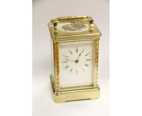 A Brass Case Carriage Clock the enamel dial with Roman numerals