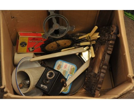 A box containing a collection of various oddments including an old camera, a Chinese carved wooden frame and other items