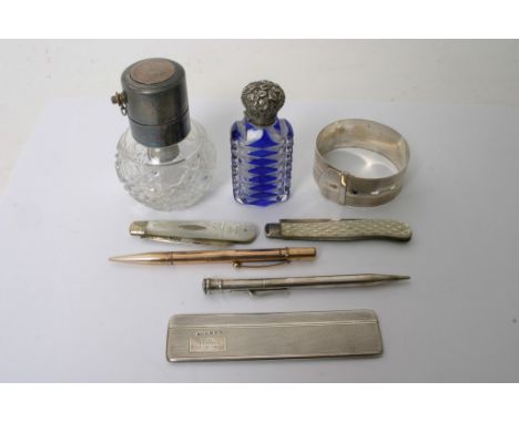 A collection of various silver Oddments comprising silver topped scent bottles, pens a bangle mother of pearl and silver frui